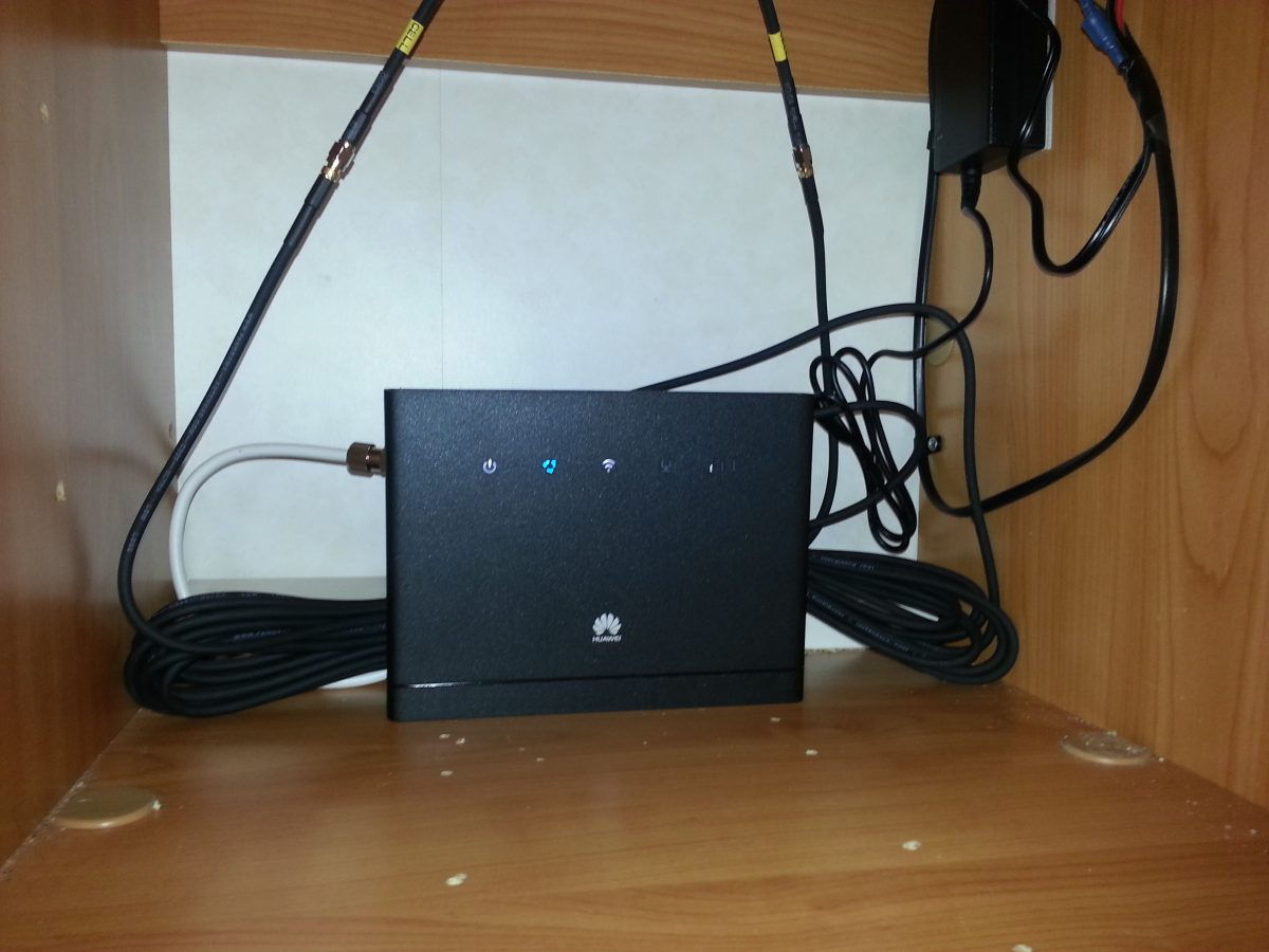 mifi router mounted in the TV cabinet with the aerial on the roof in place of the old TV aerial.